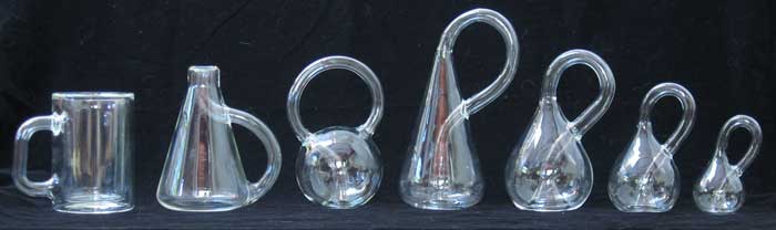 A lineup of seven varieties of klein bottles.