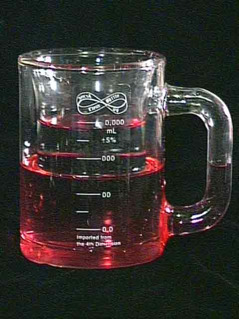 A Klein bottle shaped like a drinking mug. It has some red liquid in it.