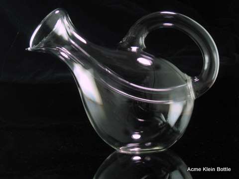 A glass wine bottle shaped like a wine carafe.